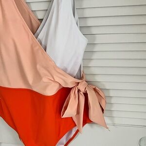 Color beautiful, coral with peach color. One piece. You still have it girl.